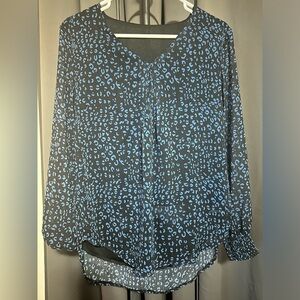 Women’s blouse. Colors: black and blue. 100% polyester. Size small.